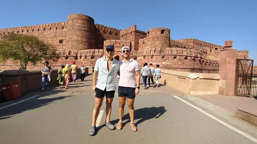 From Jaipur: Private Taj Mahal & Agra Day Trip with 5</em> Lunch – Private Jaipur to Agra: comfort that makes the whole day easier’ /><br />
The day starts with a pickup from your hotel or another place in Jaipur, and you go by private AC car. That matters because Agra is a long enough day trip that comfort is not a luxury, it is the difference between enjoying the sites and feeling wiped out.</p>
<p><p>You also get small extras that feel practical, bottled water and umbrellas. On a sunny day, those two items can save you from the usual heat scramble. Reviews repeatedly mention smooth, safe driving, and solo travelers in particular seem to appreciate feeling looked after in transit.</p>
</p>
<p><p>This is a private group, so you are not stuck moving at someone else’s pace. If your priorities are Taj first, photos, or extra questions for the guide, the flow can fit you better than a rigid group schedule.</p>
</p>
<h2>Fast-track Taj Mahal entry: what 3 hours really gives you</h2>
<p> Lunch – Fast-track Taj Mahal entry: what 3 hours really gives you’ /><br />
The Taj Mahal is famous for good reason, but the real trick is how you experience it. Here, you skip long lines with fast-track entry, which helps you arrive with your energy still intact. Then a licensed local guide meets you and walks you through the main marble spaces with stories you can actually connect to what you see.</p>
<p><p>You should plan on about <strong>3 hours at the Taj Mahal</strong>, which is enough time to do the core route, get photos from multiple points, and still slow down for details. Many visitors focus on the front view, but the guide style here is built around helping you notice how the building works in real life, from symmetry to materials to how people move through the monument.</p>
</p>
<p><p>One practical note, the Taj Mahal is closed every Friday. If you land on a Friday, your whole plan needs to shift. Also, this tour works best when you bring your <strong>passport or ID</strong> and <strong>sunglasses</strong>, because the entry flow and sun exposure can be unavoidable.</p>
</p>
<h2>Getting your guide to work for you at the Taj</h2>
<p> Lunch – Getting your guide to work for you at the Taj’ /><br />
A big reason this trip earns such strong ratings is the human piece. Guides named in past bookings include <strong>Ankur Sharma</strong>, <strong>Arif</strong>, <strong>Imran Ali Khan</strong>, <strong>Anshu</strong>, and <strong>Mehfooz</strong>. Across these guides, the pattern is consistent: you get clear explanations and help with photo timing.</p>
<p><p>You can make the most of this by asking simple, specific questions as you walk, like where to stand for the best angles, or what to look for in the marble work. Many guides also help with taking photos using your phone, which is a big deal when you are traveling solo or want pictures that do not look like hurried snapshots.</p>
</p>
<p><p>If you care about photos, this is also where fast-track timing helps you. You are less rushed, and you can position yourself without that scramble feeling that steals the joy.</p>
</p>
<h2>Agra Fort after lunch: the Mughal story you can walk through</h2>
<p><img width="689" height="650" decoding="async" src=